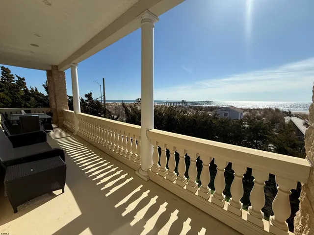 a view of a balcony with wooden floor