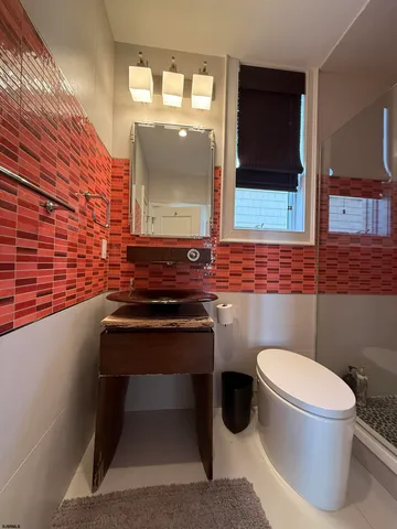 a bedroom with bed and a window