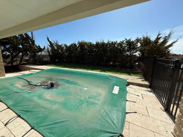 a view of a room with window and hardwood floor