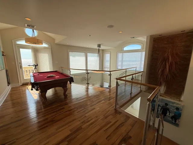 a spacious bedroom with a bed and a large window