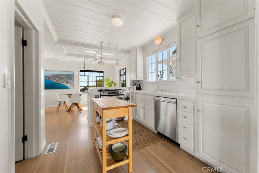 500 Mountain Road Laguna Beach, CA 92651 - Photo 11 of 36 a kitchen with appliances a sink and cabinets