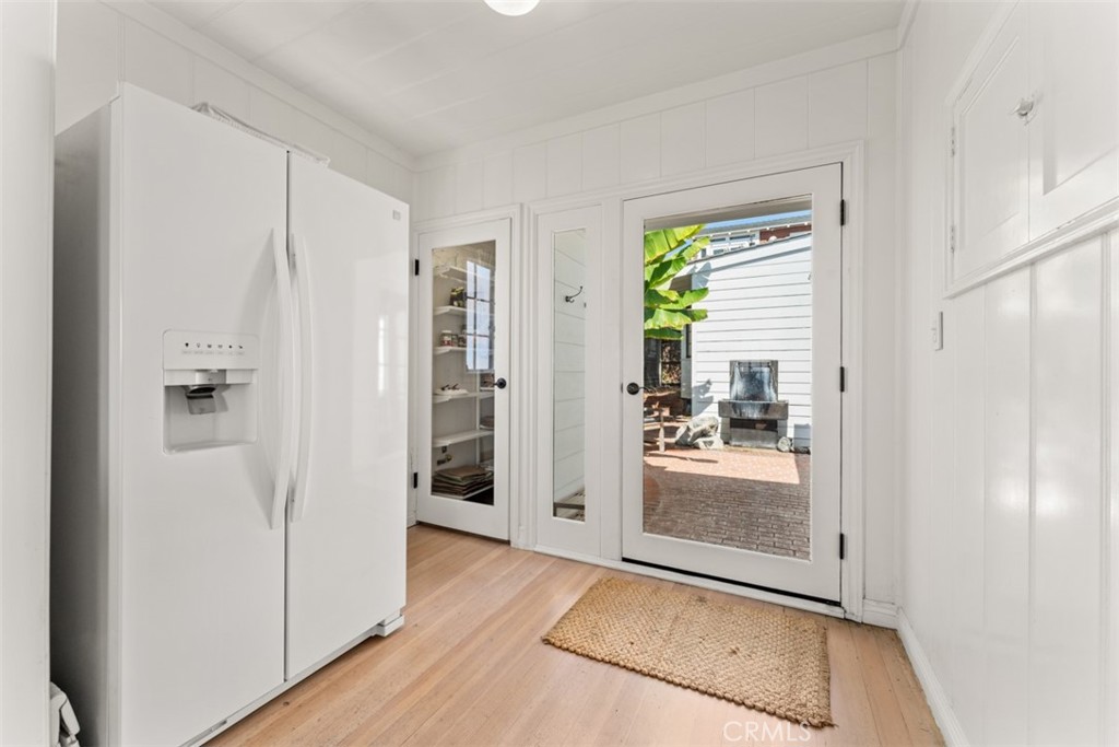 500 Mountain Road Laguna Beach, CA 92651 - Photo 12 of 36 a view of a hallway with wooden floor and a cabinet