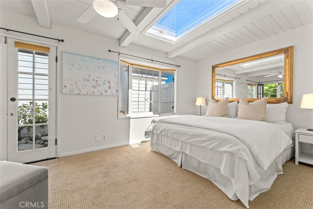 500 Mountain Road Laguna Beach, CA 92651 - Photo 18 of 36 a spacious bedroom with a large bed and a window