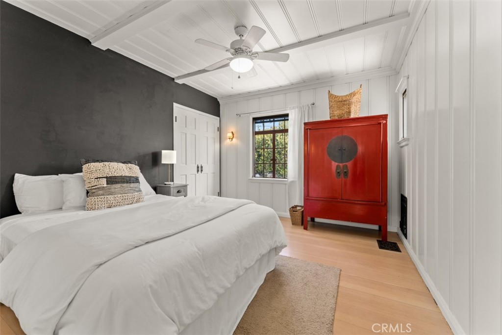 500 Mountain Road Laguna Beach, CA 92651 - Photo 21 of 36 a bedroom with a bed and a chandelier