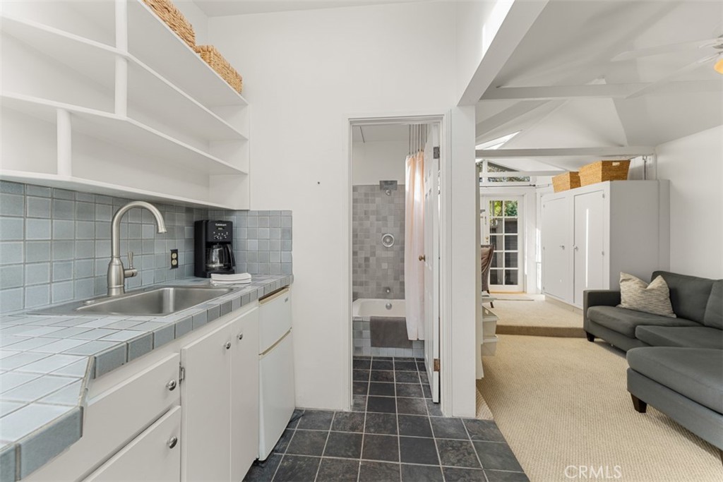 500 Mountain Road Laguna Beach, CA 92651 - Photo 26 of 36 a spacious bathroom with a double vanity sink a mirror and a shower