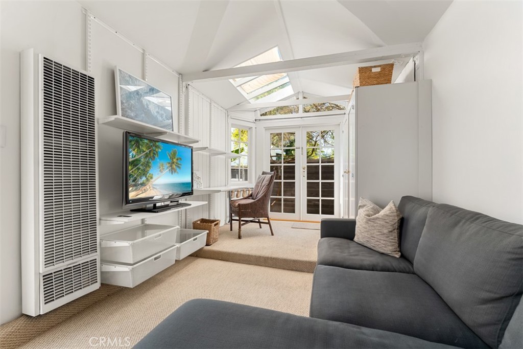 500 Mountain Road Laguna Beach, CA 92651 - Photo 28 of 36 a living room with furniture tv and a large window