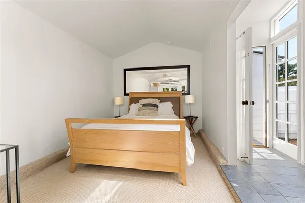 a bedroom with a bed and a table