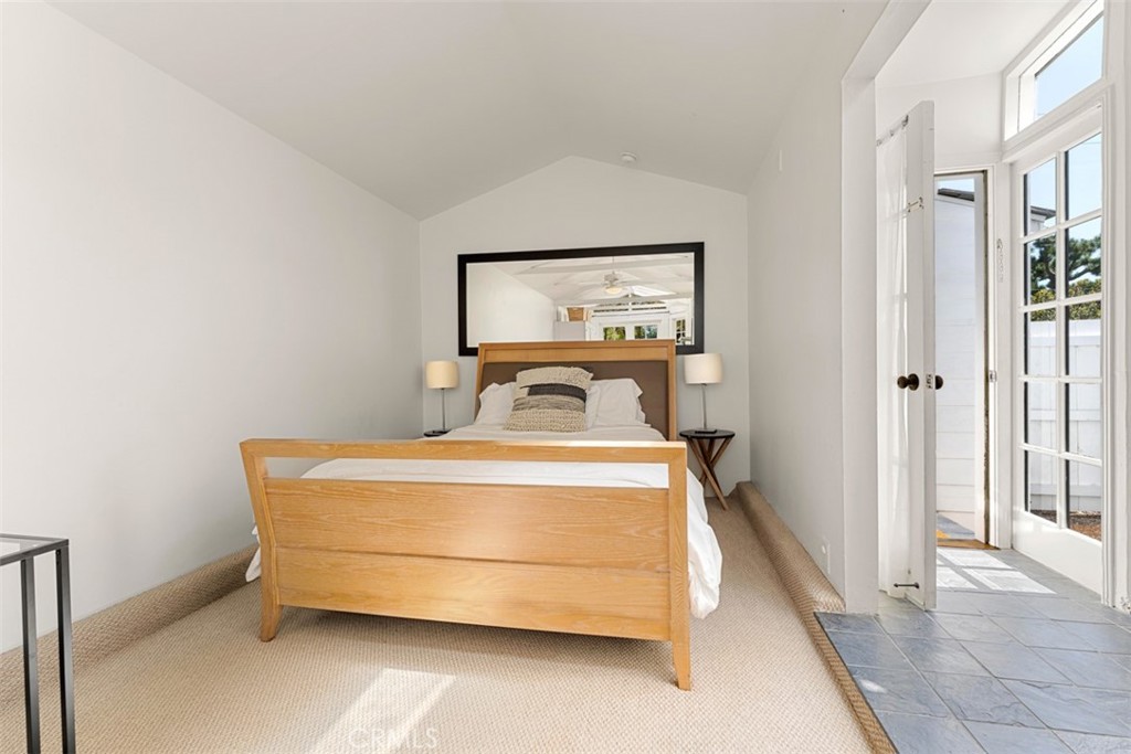 500 Mountain Road Laguna Beach, CA 92651 - Photo 29 of 36 a bedroom with a bed and a table
