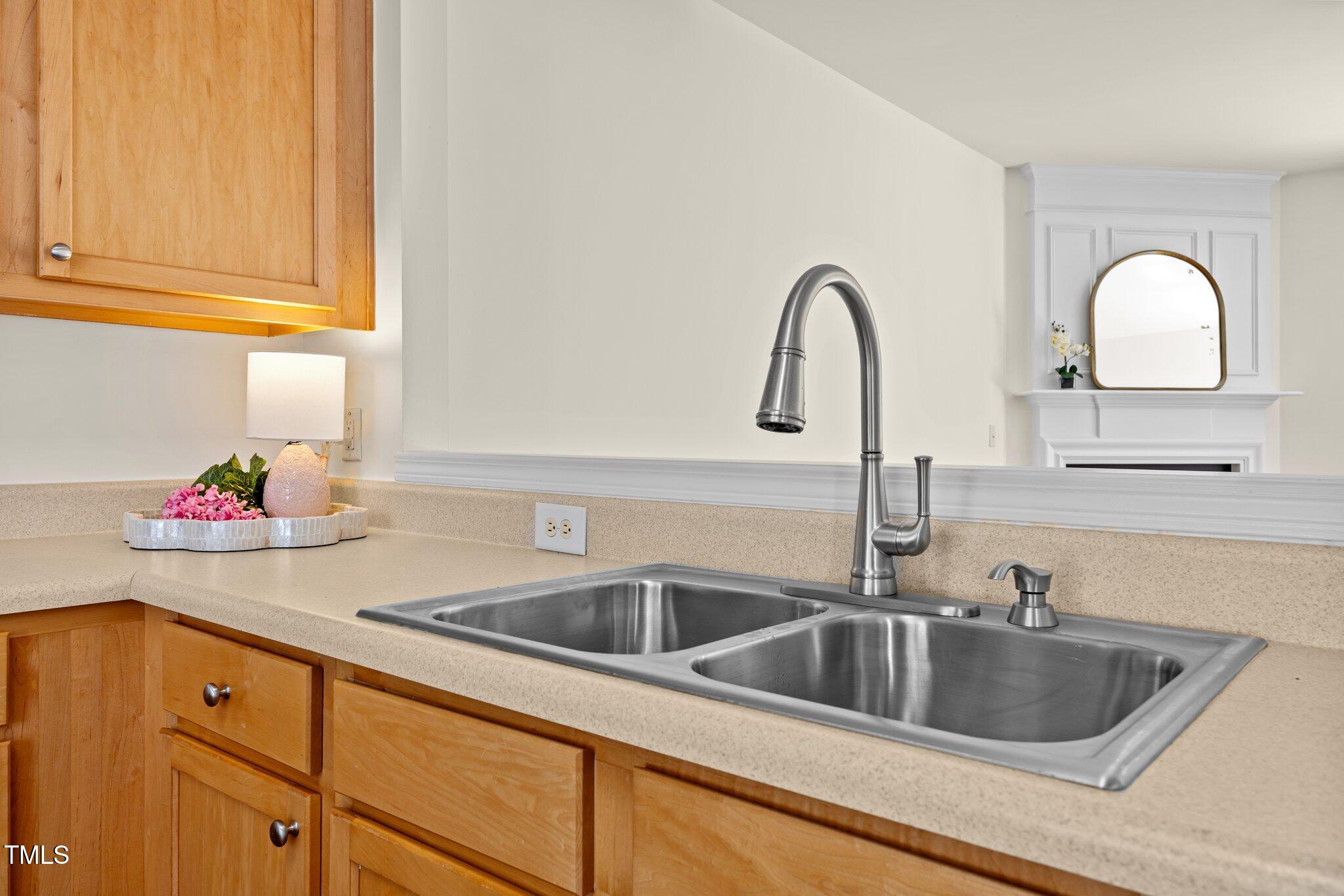 8151 Rhiannon Road Raleigh, NC 27613 - Photo 11 of 40 a kitchen with sink and a window