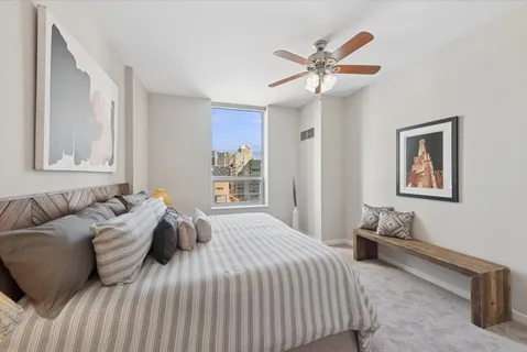 a bedroom with a bed and window