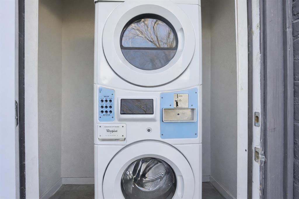901 Bessie Street Fort Worth, TX 76104 - Photo 24 of 28 Coin-operated stacked laundry unit on the east side of property
