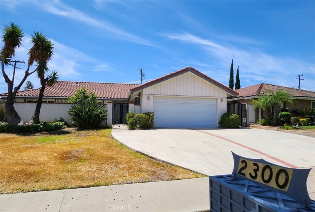 2300 El Rancho Vista Fullerton, CA 92833 - Photo 1 of 23 a front view of a house with a yard