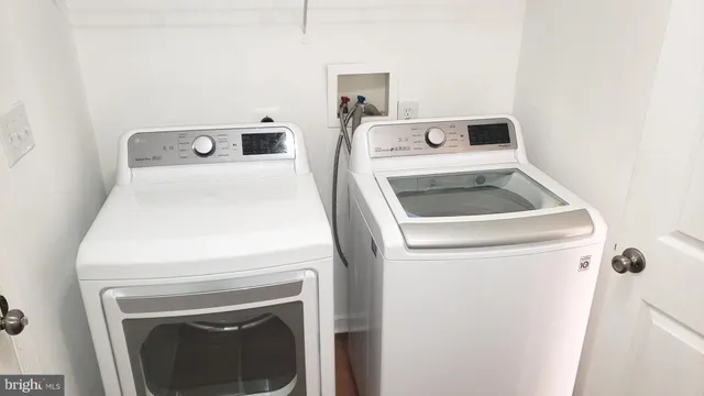 a view of storage and utility room with closet