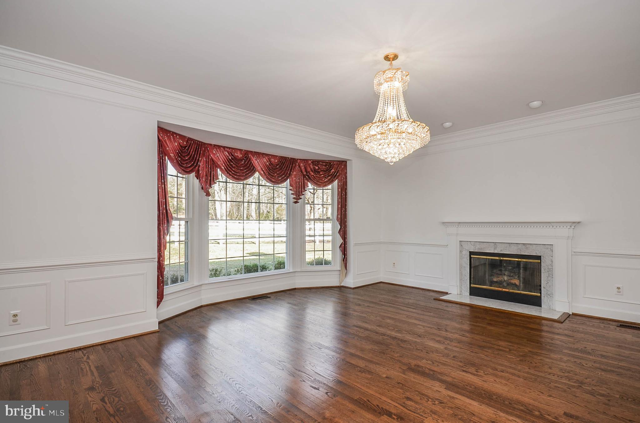 12009 Wetherfield Lane Potomac, MD 20854 - Photo 5 of 46 Living room with fireplace