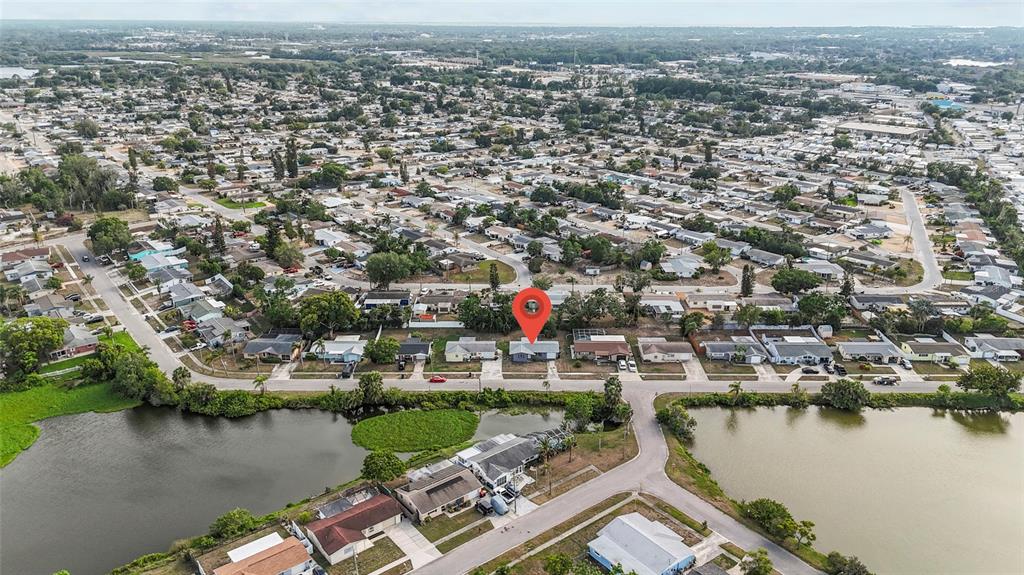 1623 Plum Tree Road Holiday, FL 34690 - Photo 22 of 33 an aerial view of a city with lake view