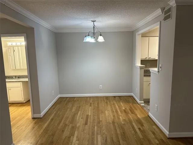 a kitchen with granite countertop a sink and cabinets
