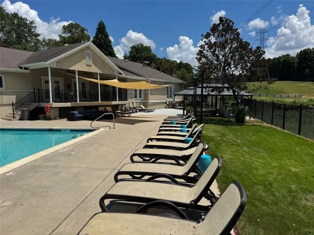 a patio with patio table and chairs