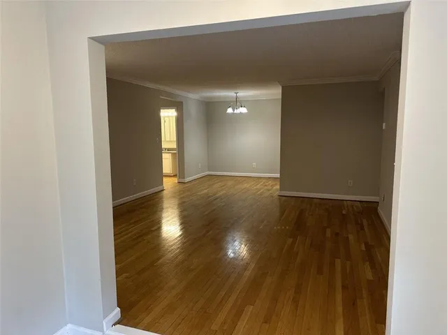 a view of a livingroom with a fireplace and a ceiling fan