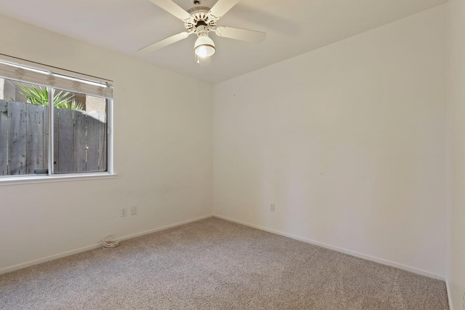 2449 Calvert Street Stockton, CA 95210 - Photo 24 of 37 a view of an empty room with a window