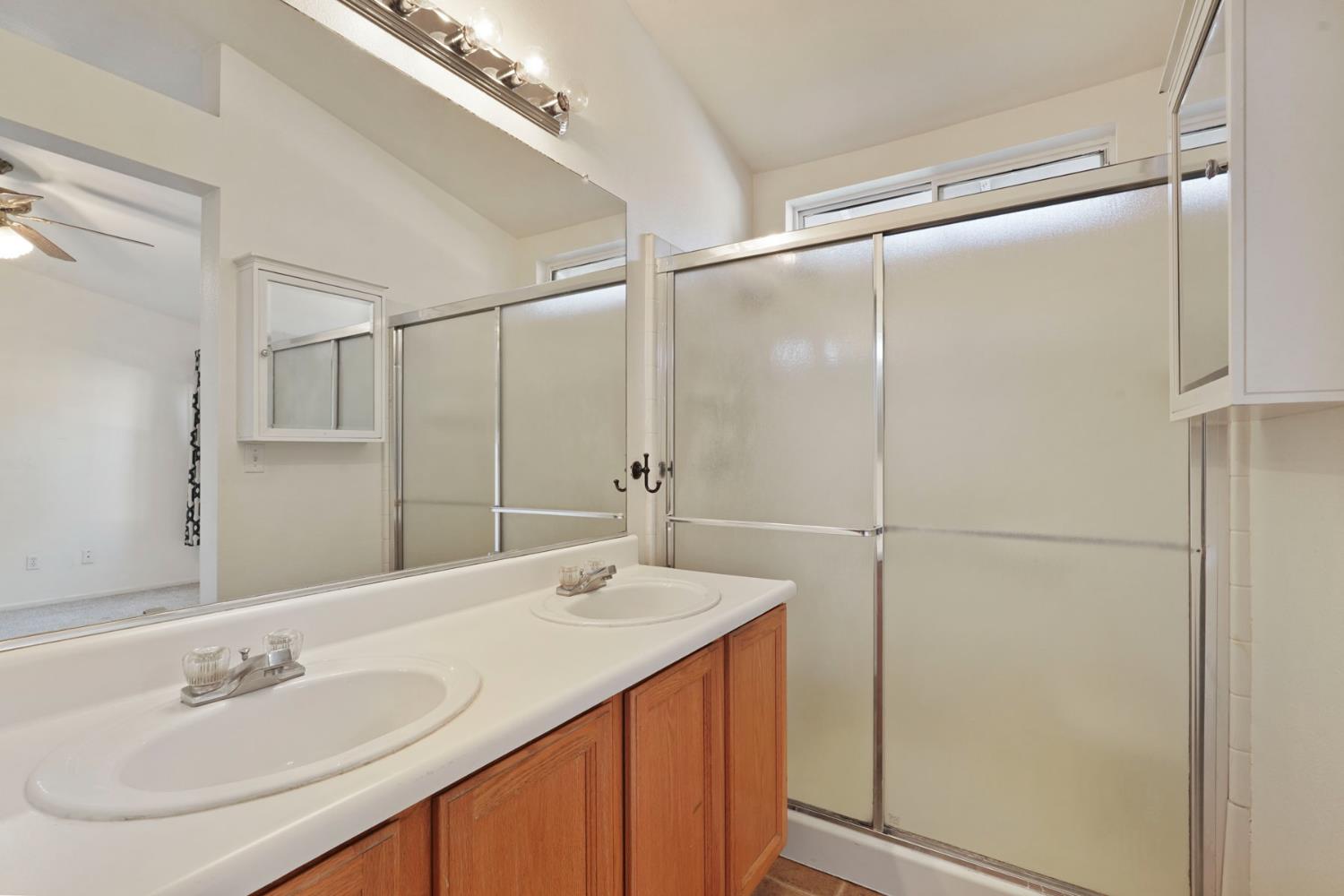 2449 Calvert Street Stockton, CA 95210 - Photo 29 of 37 a bathroom with a sink and a mirror
