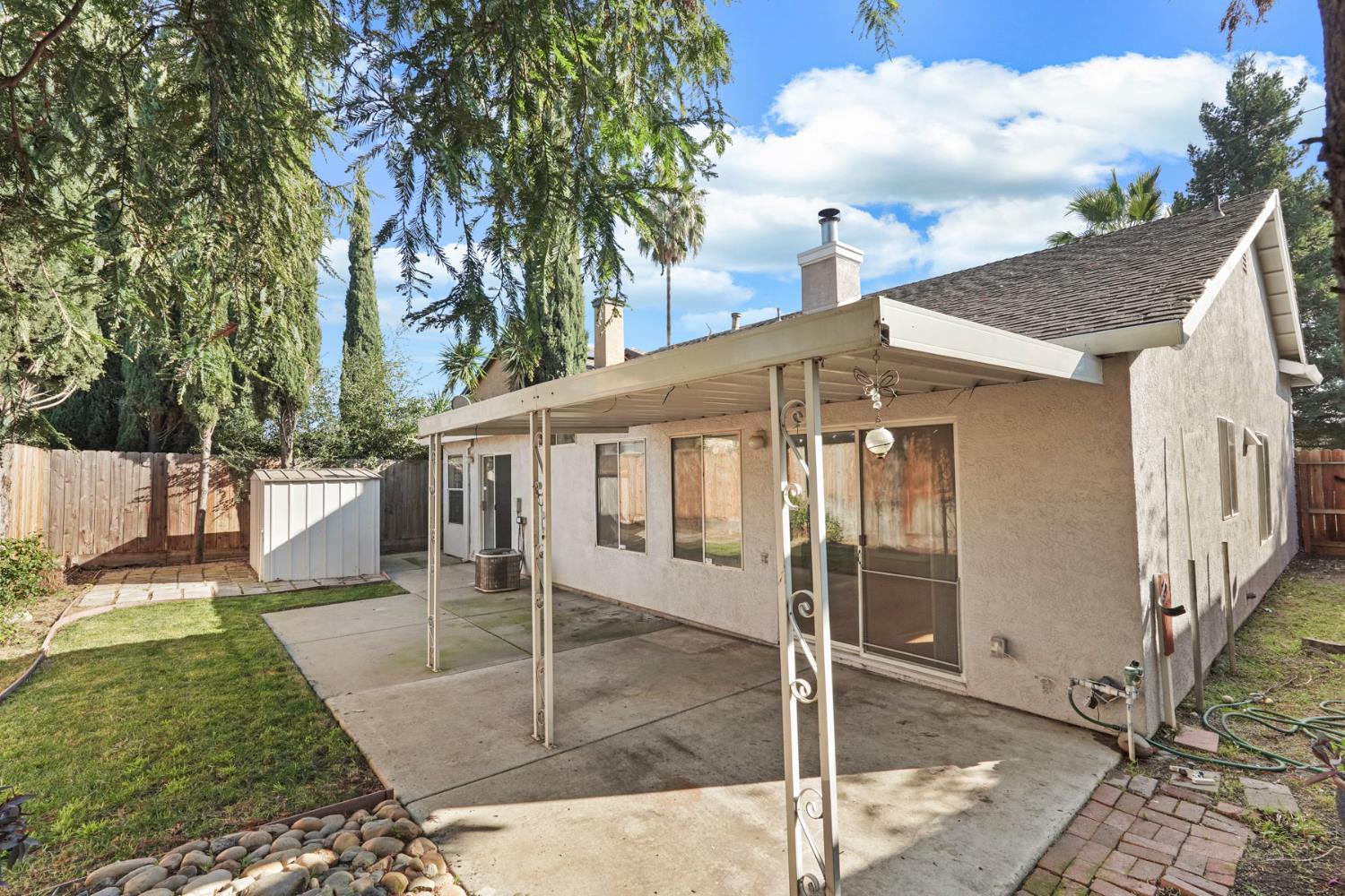 2449 Calvert Street Stockton, CA 95210 - Photo 31 of 37 a front view of a house with garden