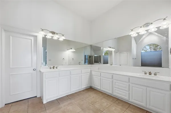 a bathroom with a tub and a shower