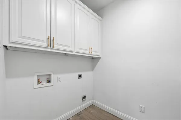 a view of cabinets and wooden floor