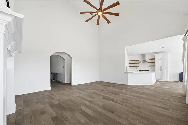 a view of entryway with wooden floor and stairs