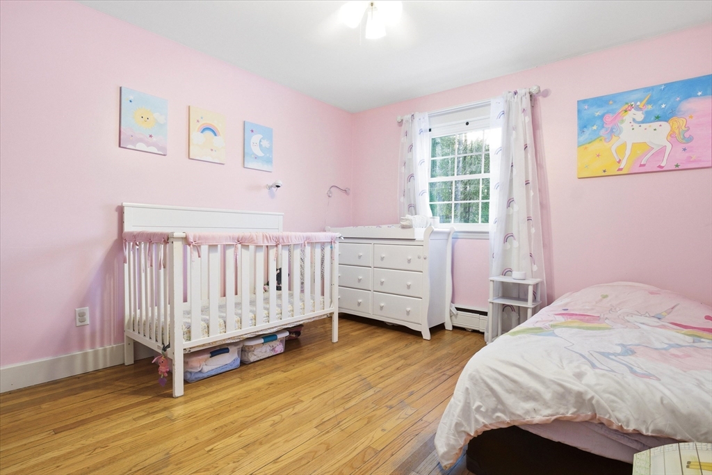16 Worcester Road Townsend, MA 01469 - Photo 20 of 42 a bedroom with a bed and a window