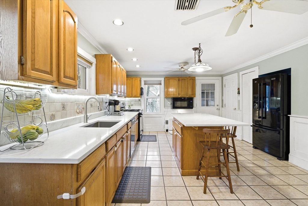 16 Worcester Road Townsend, MA 01469 - Photo 6 of 42 a kitchen with a sink a counter top space and stainless steel appliances