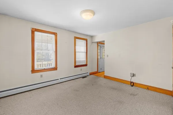 a view of an empty room with a window