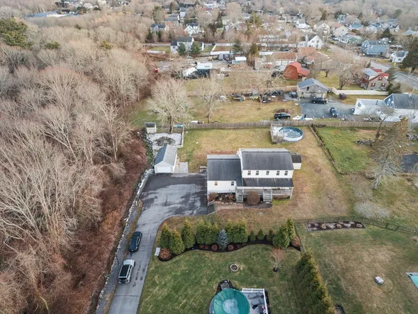 an aerial view of a house with outdoor space