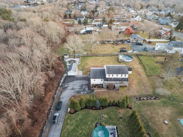an aerial view of a house with outdoor space