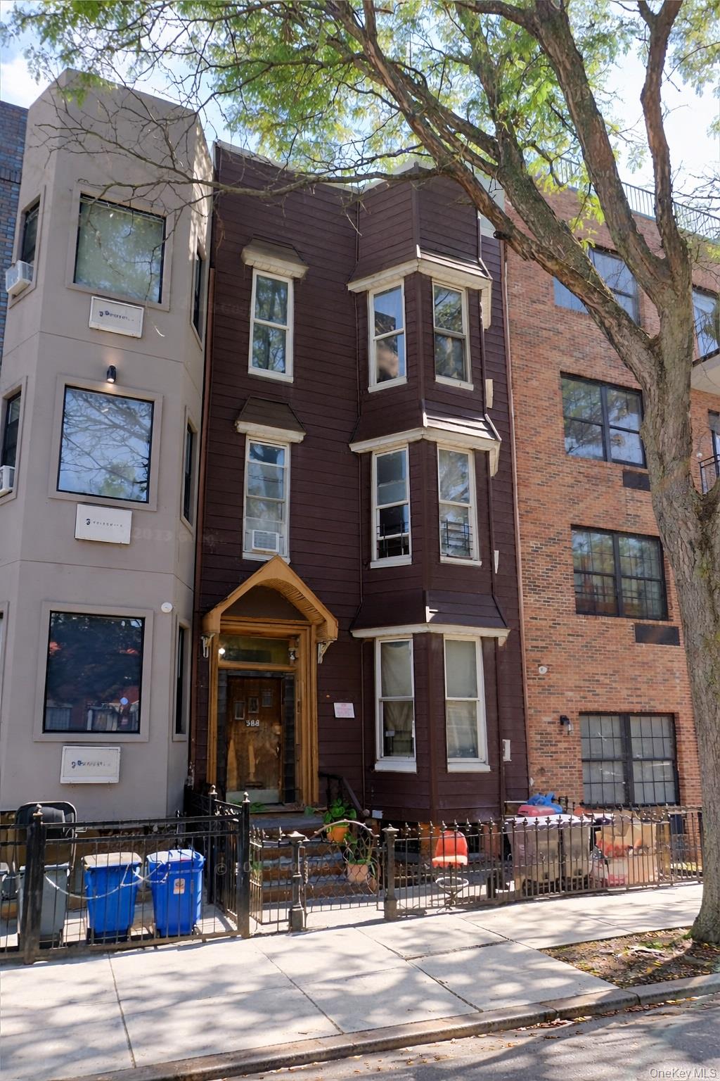 988 Madison Street Brooklyn, NY 11221 - Photo 1 of 1 View of front of home with a fenced front yard