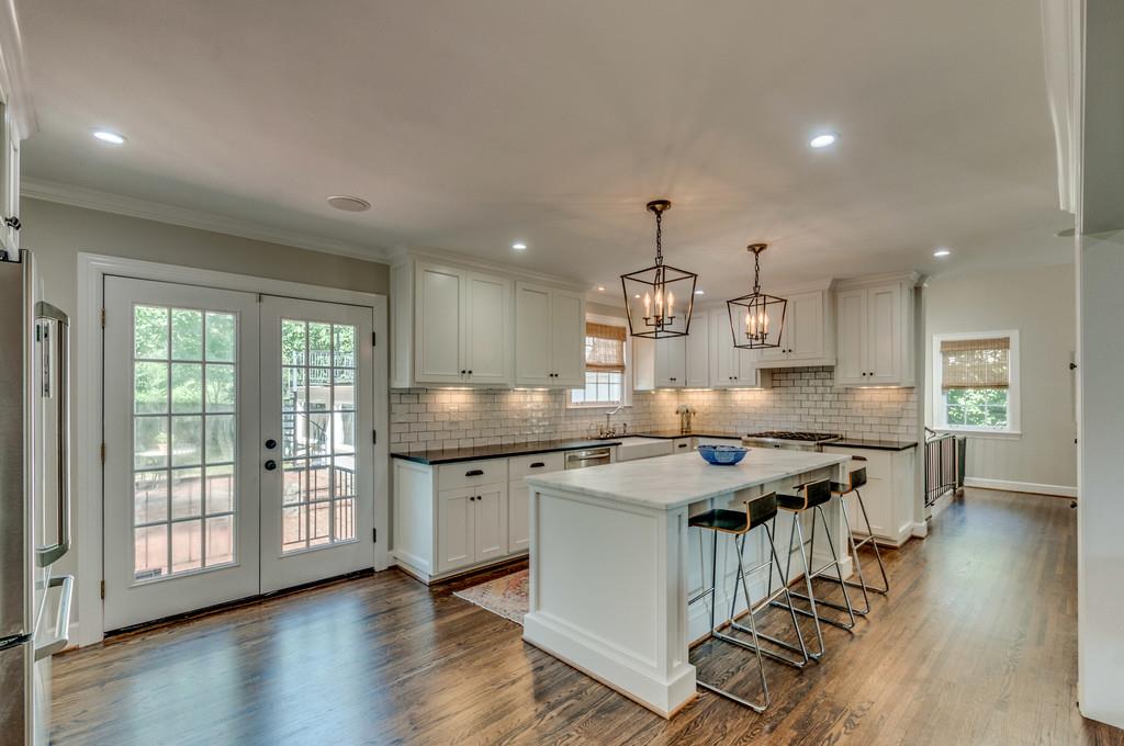 138 Alton Road Nashville, TN 37205 - Photo 6 of 29 Ashley Rohe Designed Kitchen. Open Concept. French Doors Lead to Brick patio.