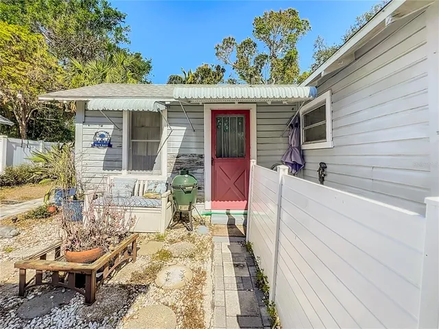 a front view of a house with a bench