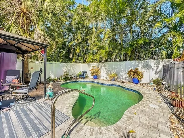 a view of a swimming pool with a patio