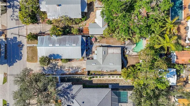 an aerial view of a house with outdoor space