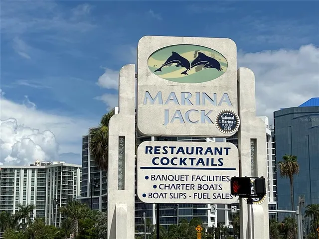 a sign on a wall next to road