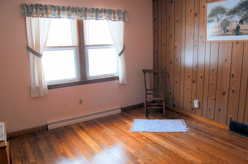 600 River Road Clarksburg, MA 01247 - Photo 19 of 20 an empty room with wooden floor and windows