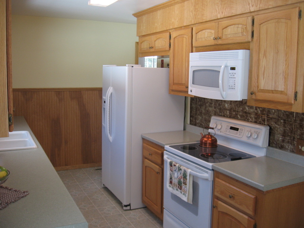 600 River Road Clarksburg, MA 01247 - Photo 5 of 20 a kitchen with a stove and a refrigerator