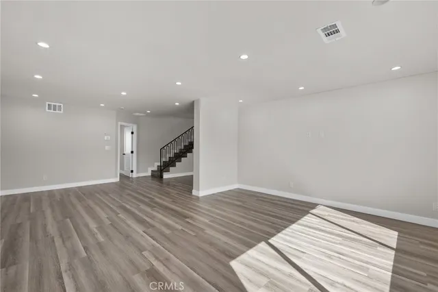 a view of a livingroom with wooden floor