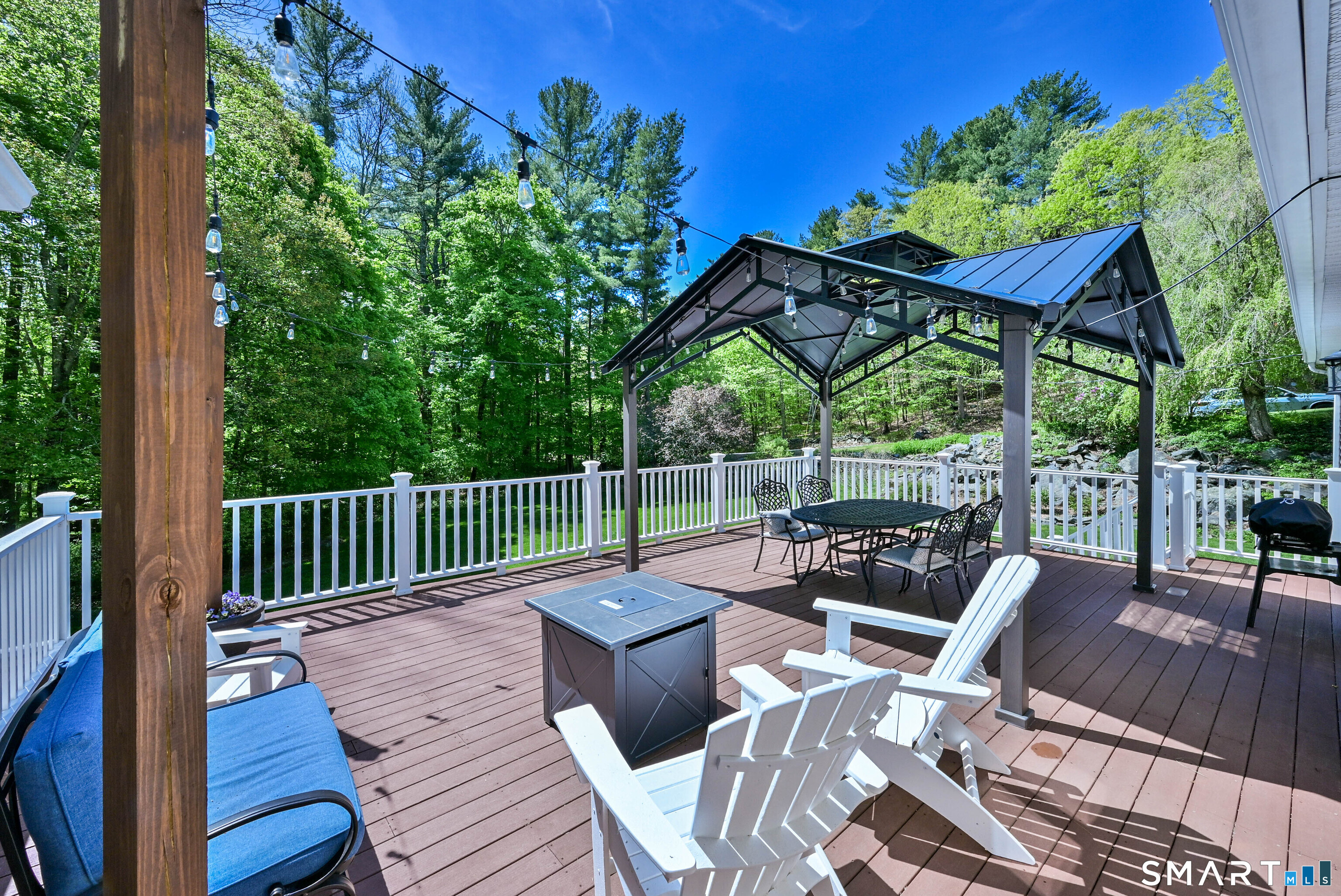 309 O'Leary Road Thompson, CT 06277 - Photo 11 of 40 a view of a patio with couches chairs and wooden floor