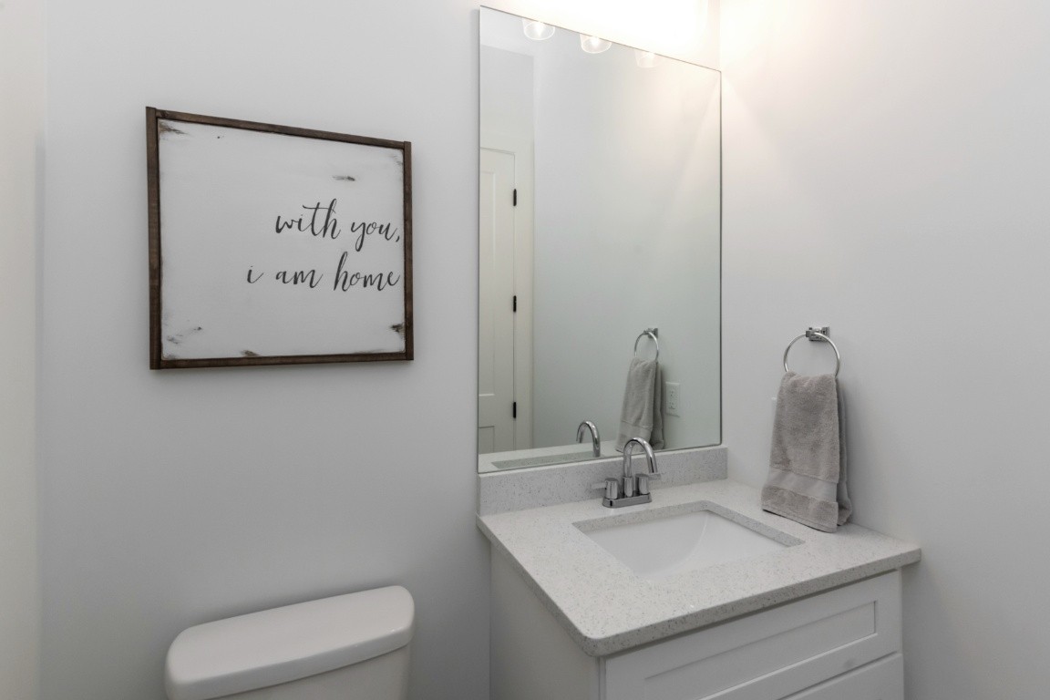 6926 Cairo Bend Road Lebanon, TN 37087 - Photo 18 of 42 a bathroom with a toilet sink and mirror