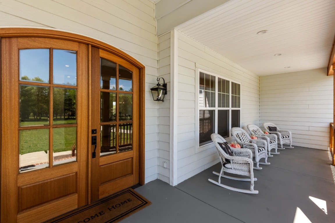 6926 Cairo Bend Road Lebanon, TN 37087 - Photo 3 of 42 a view of a hallway with a dining room and glass door