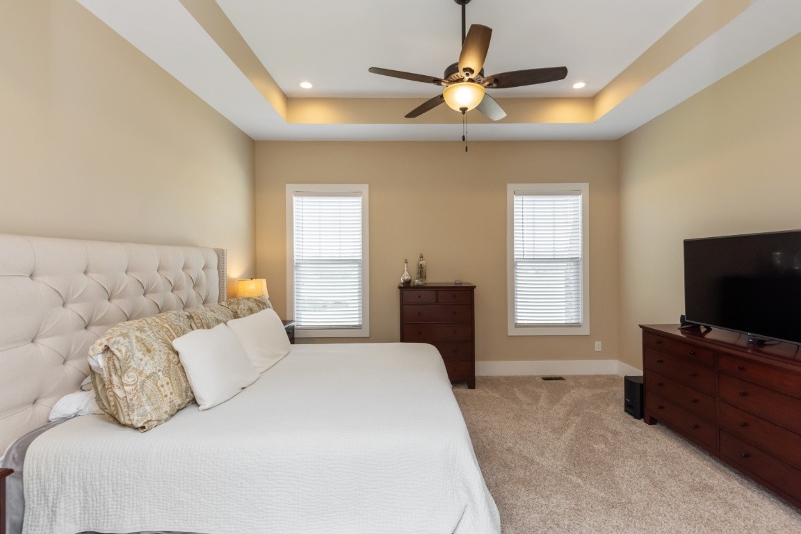 6926 Cairo Bend Road Lebanon, TN 37087 - Photo 21 of 42 a bedroom with a bed and a flat screen tv