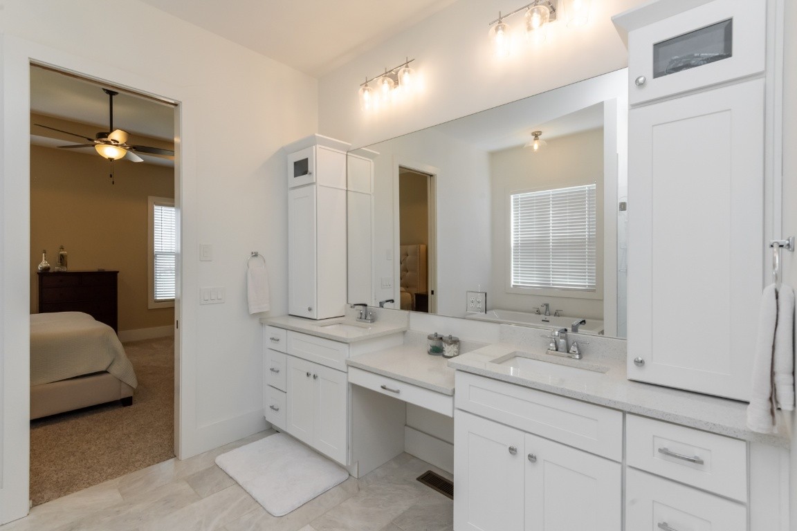 6926 Cairo Bend Road Lebanon, TN 37087 - Photo 22 of 42 a en suite bathroom with double sink and a mirror