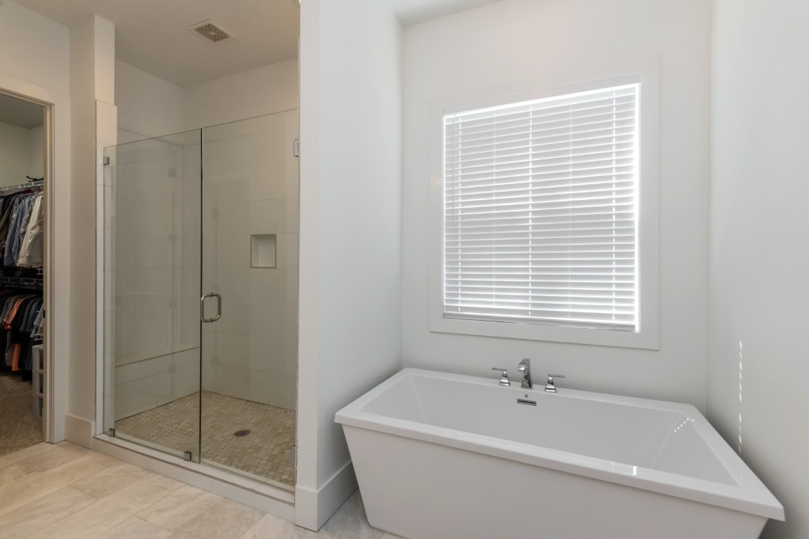 6926 Cairo Bend Road Lebanon, TN 37087 - Photo 23 of 42 a bathroom with a bathtub and shower