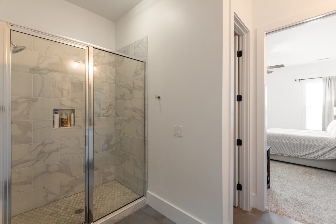 6926 Cairo Bend Road Lebanon, TN 37087 - Photo 32 of 42 a bathroom with a glass shower door