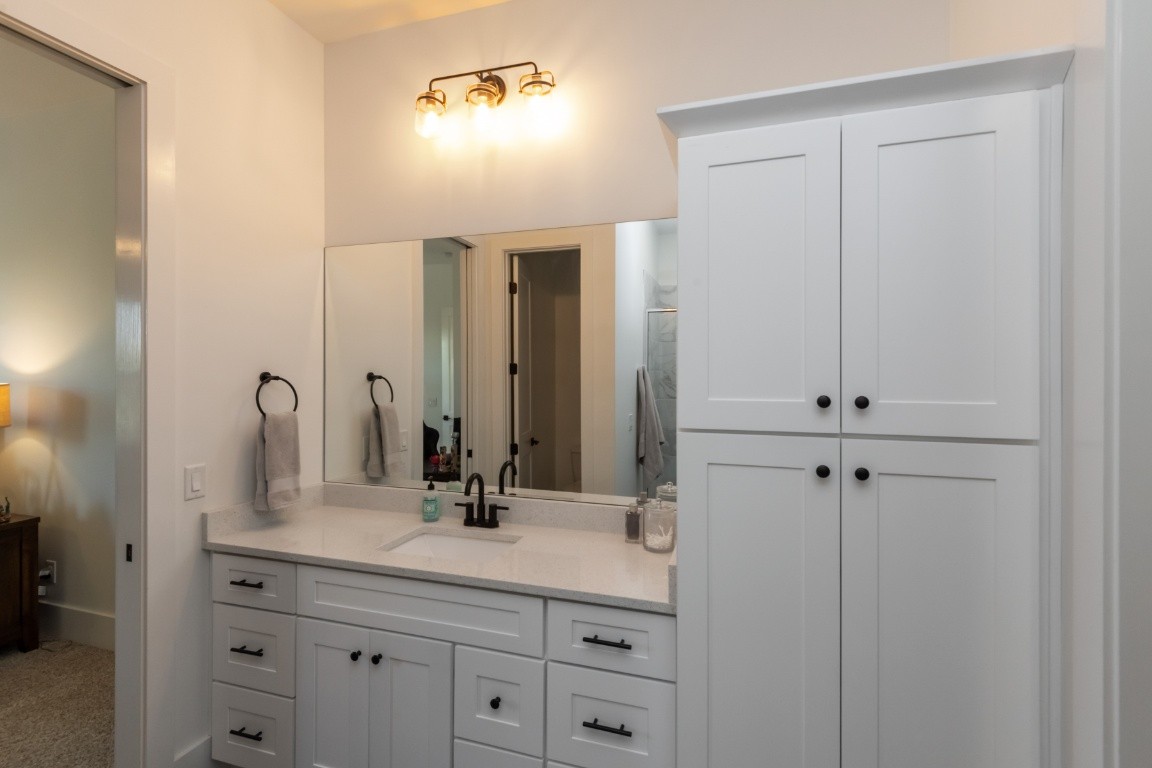 6926 Cairo Bend Road Lebanon, TN 37087 - Photo 33 of 42 a bathroom with a double vanity sink and a mirror